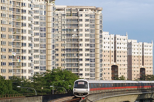 MRT train passing by executive condominiums