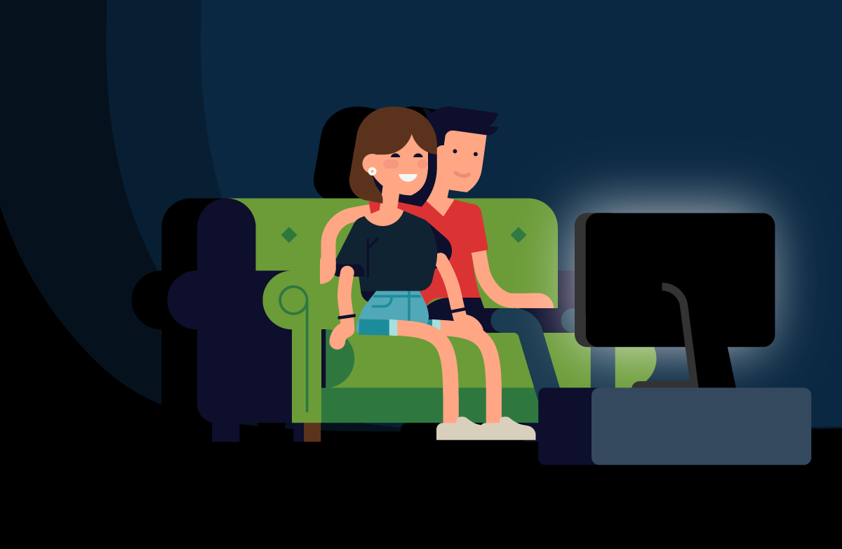 Image of a couple sitting on a sofa and watching TV