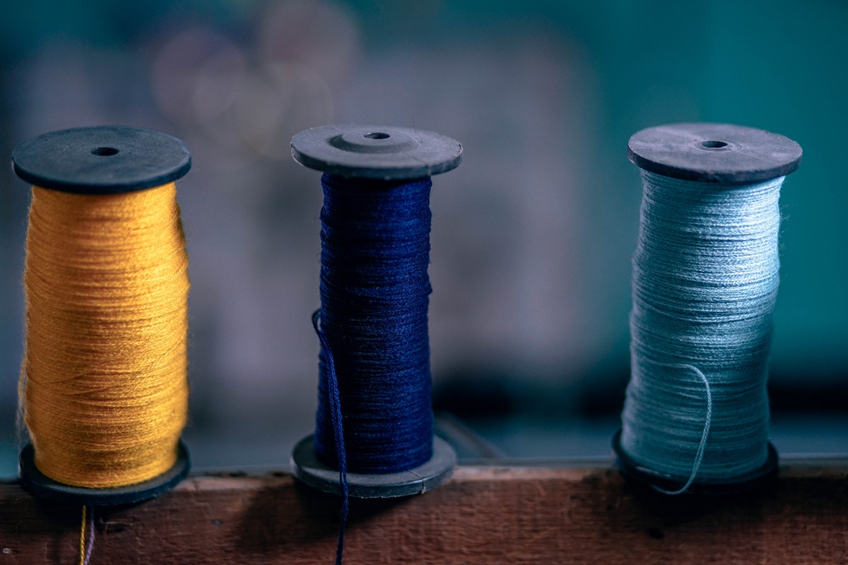 Image of a few spools of colourful thread