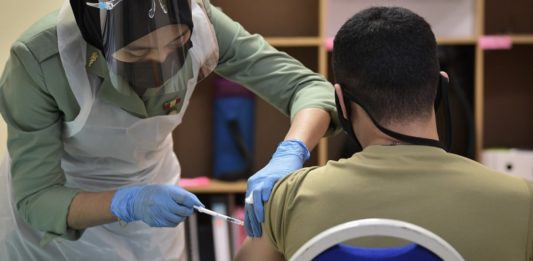 should-low-paid-workers-get-covid-19-vaccine-priority-over-the-middle,-upper-class?