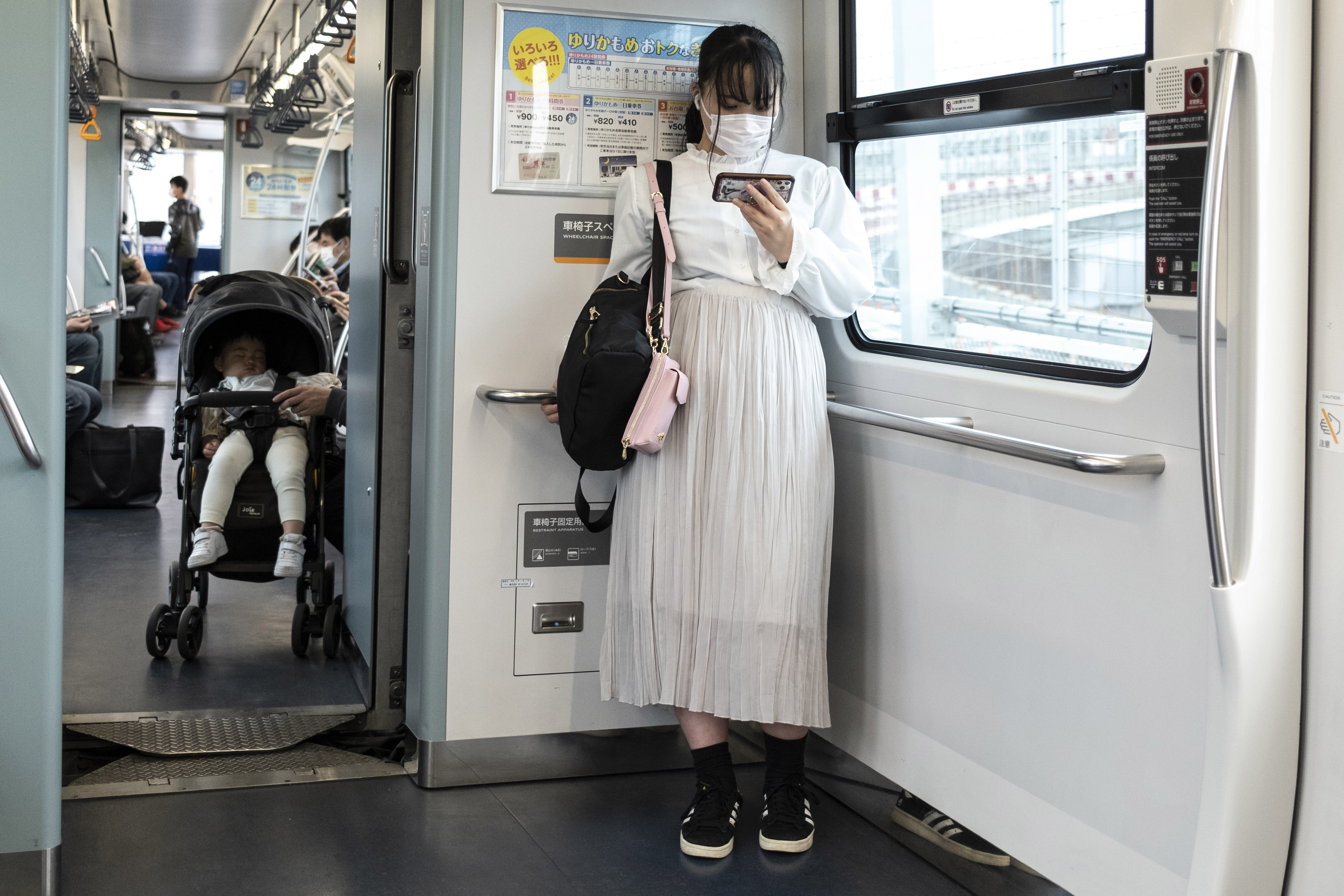 Life hack? Woman says she always gets a seat on the train by moving close enough to seated guys to let her dress flow over their knees