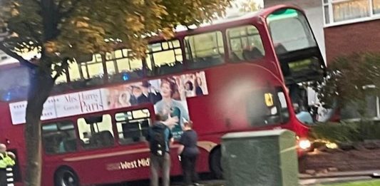 bus-driver-dies-after-‘medical-episode’-at-the-wheel,-crashing-into-bmw-and-house