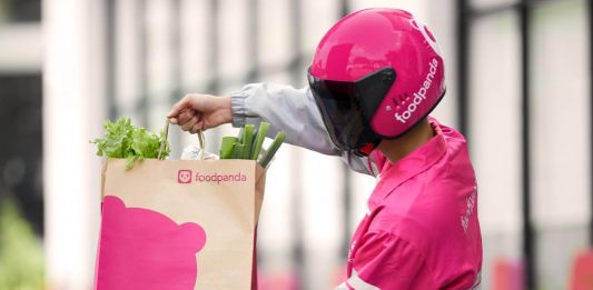 Foodpanda rider holding a bag