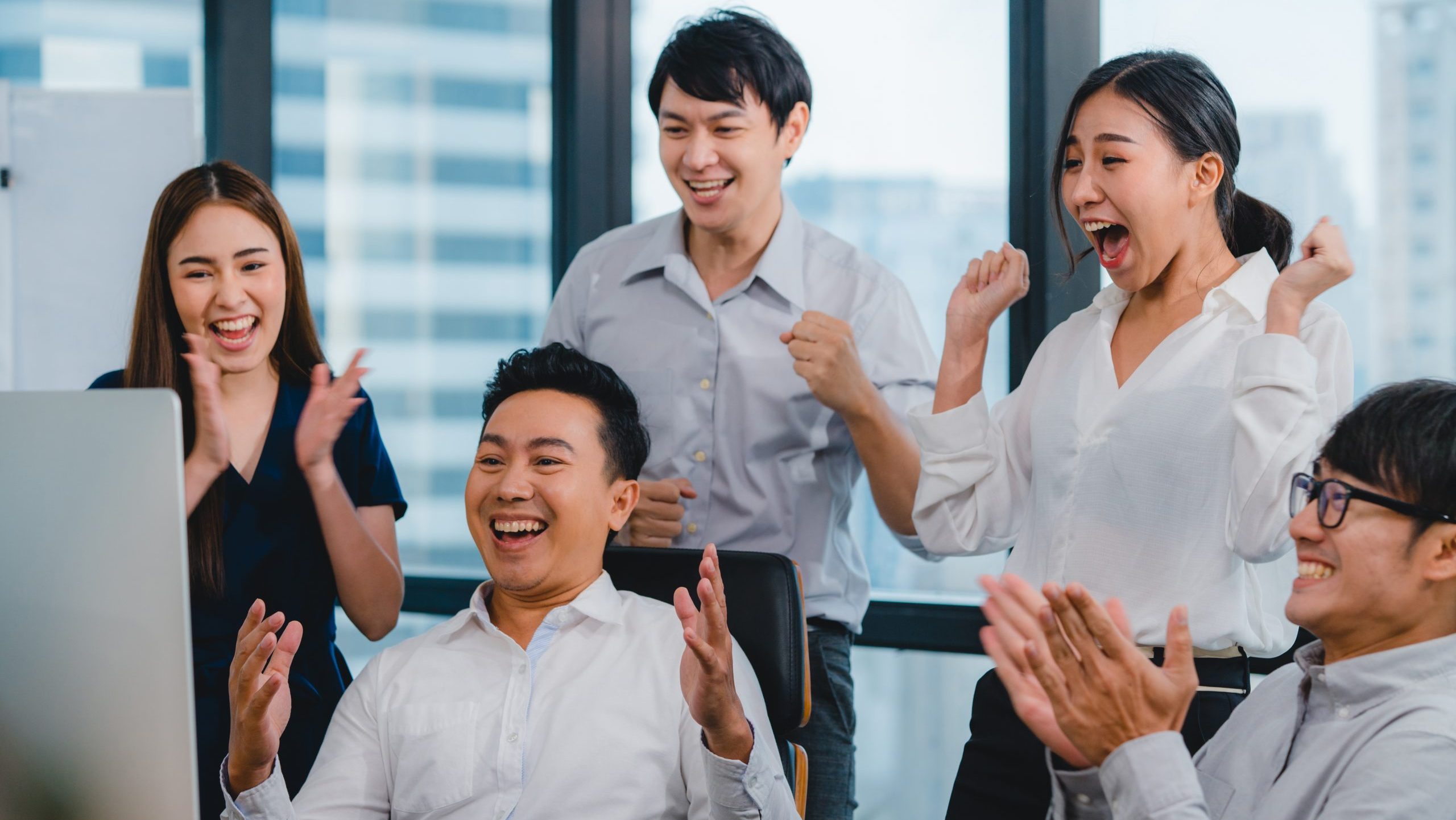 Coworkers celebrating in the workplace