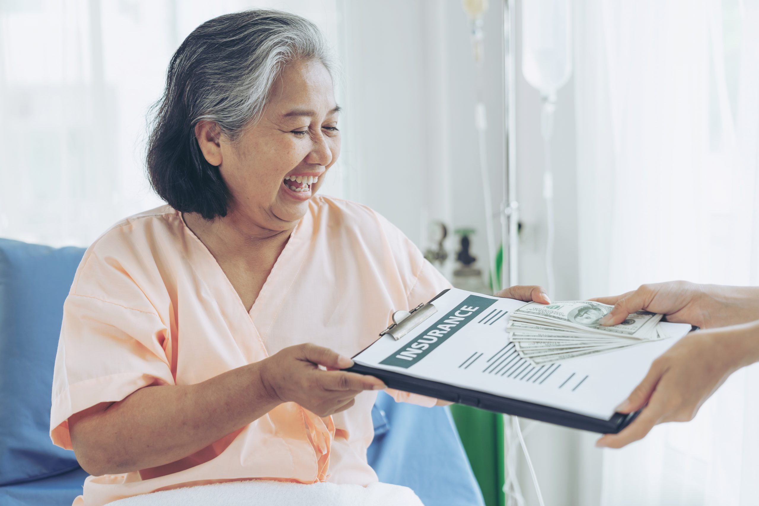 Elederly patient in a hospital getting an insurance claim