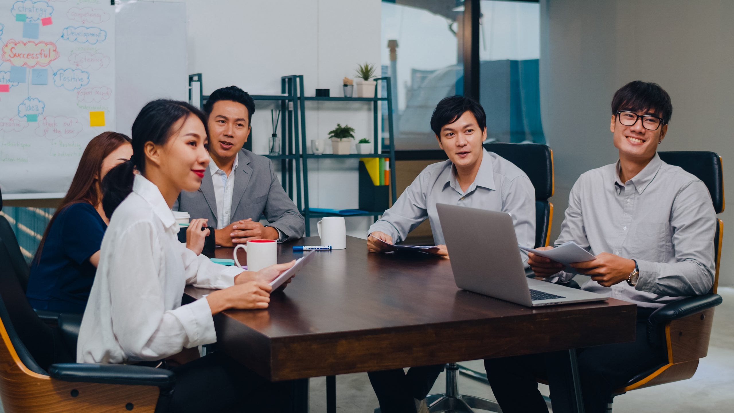 Men and women meeting in the office.