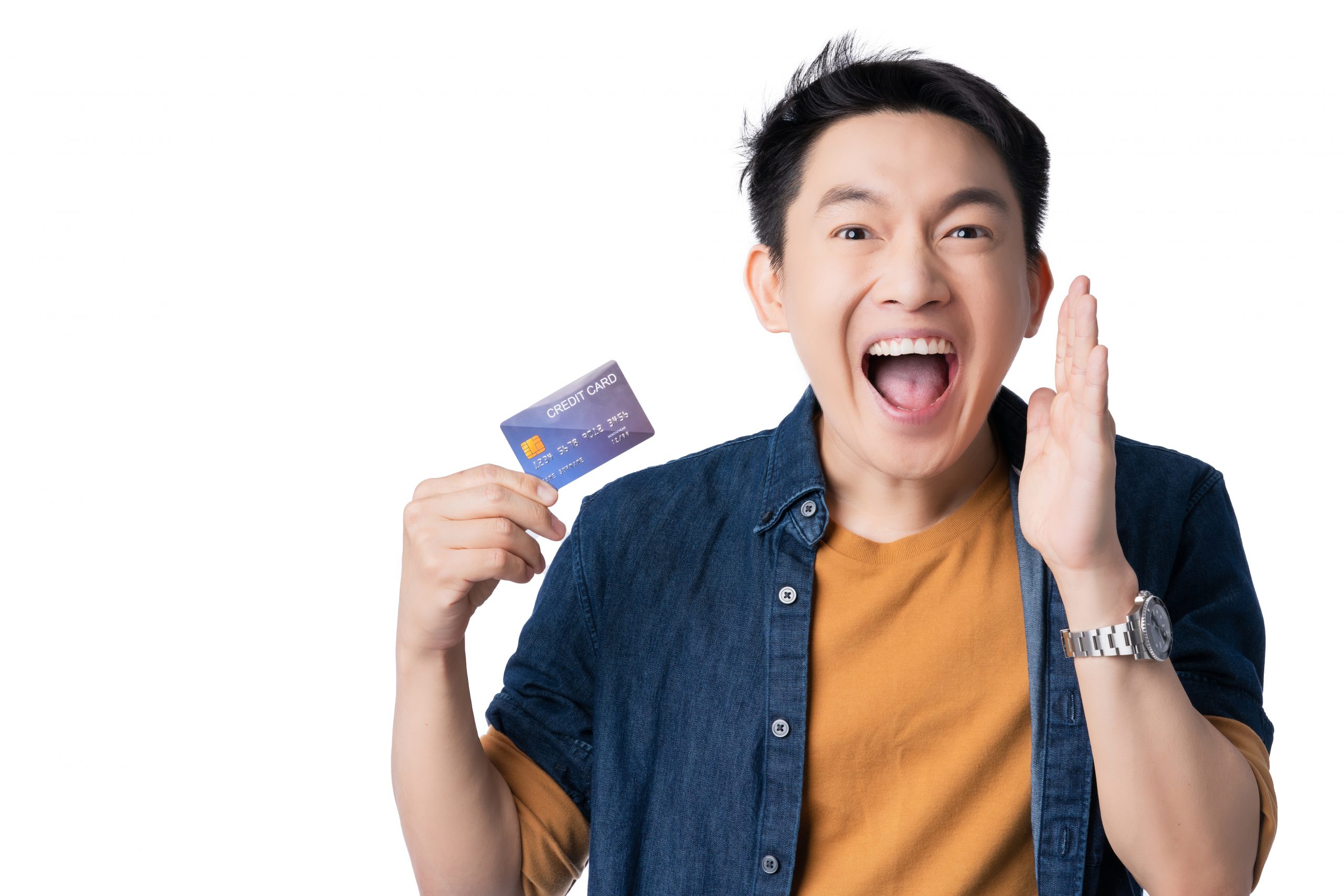 Asian man holding a credit card while trying to say something.