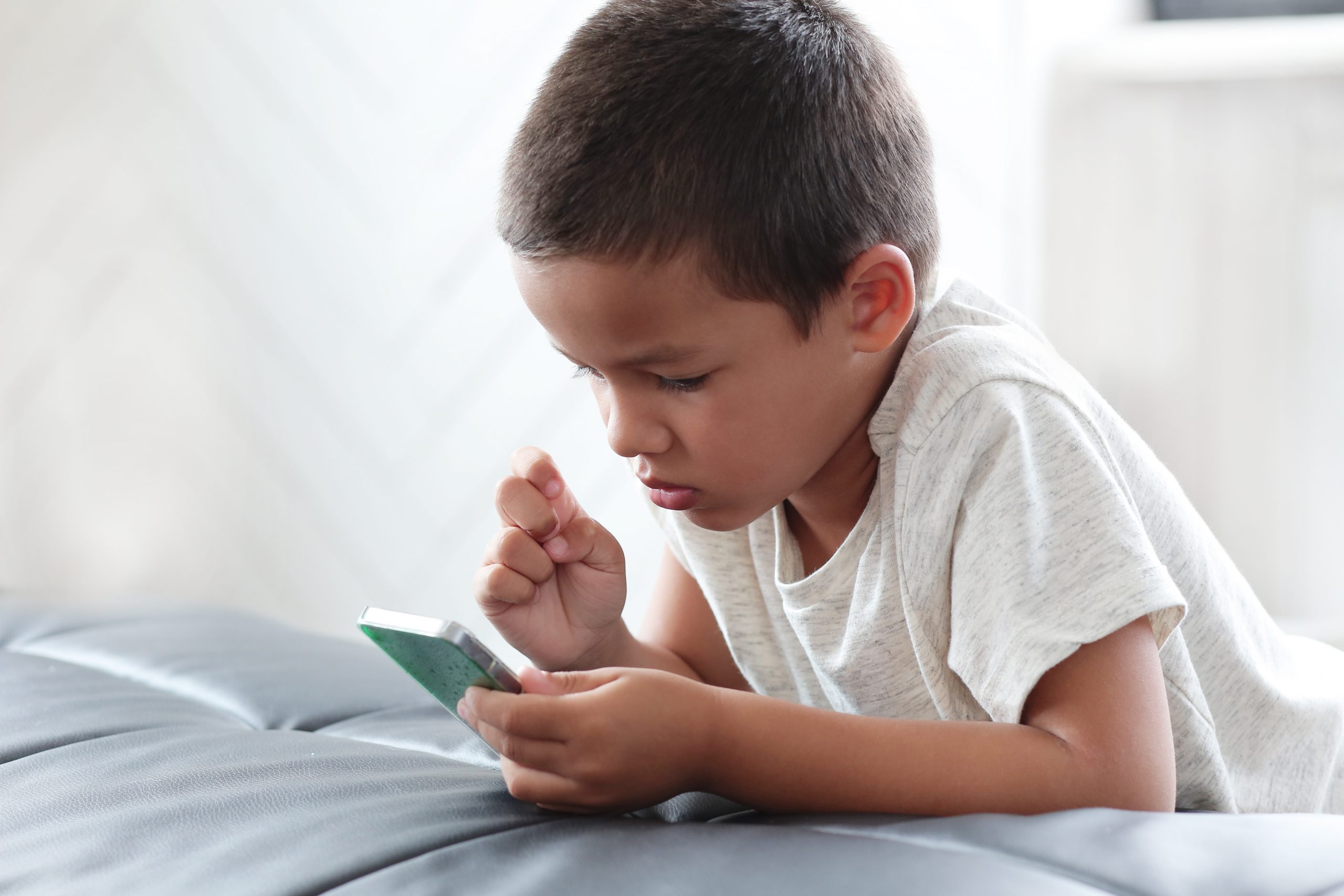 Boy using phone.