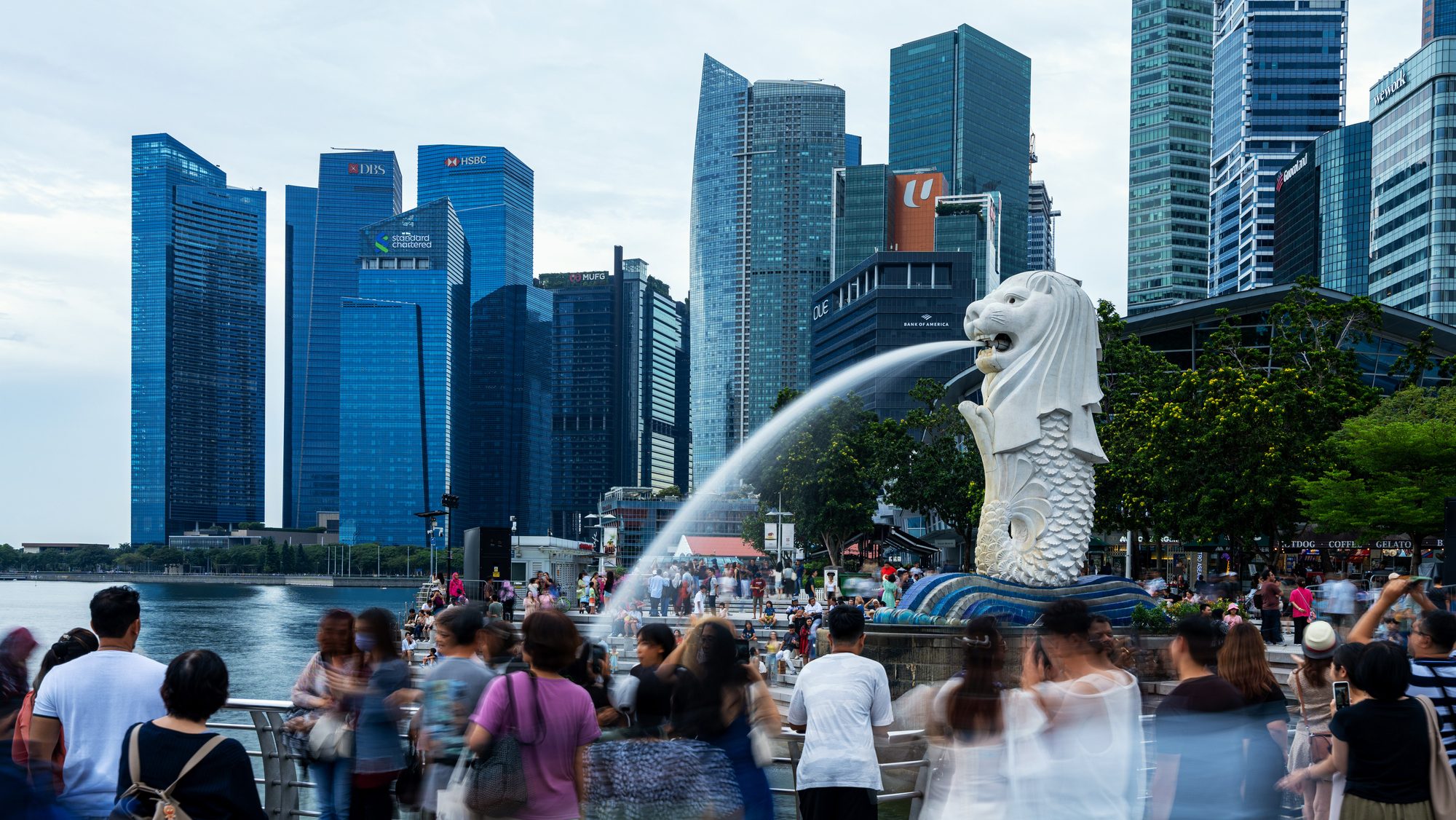 People in Singapore near Merlion.