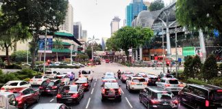 In Singapore, you don’t just buy a car—you compete for the right to own one Traffic in streets of Singapore