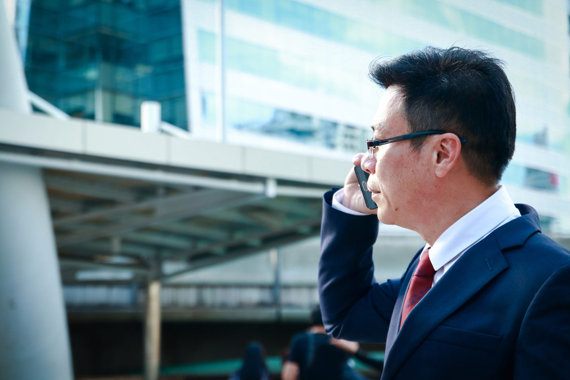 Asian businessmen wearing glasses, calling, talking to customers