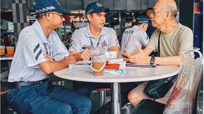 An elderly Singaporean having coffee with cops (Sengkang NPC)