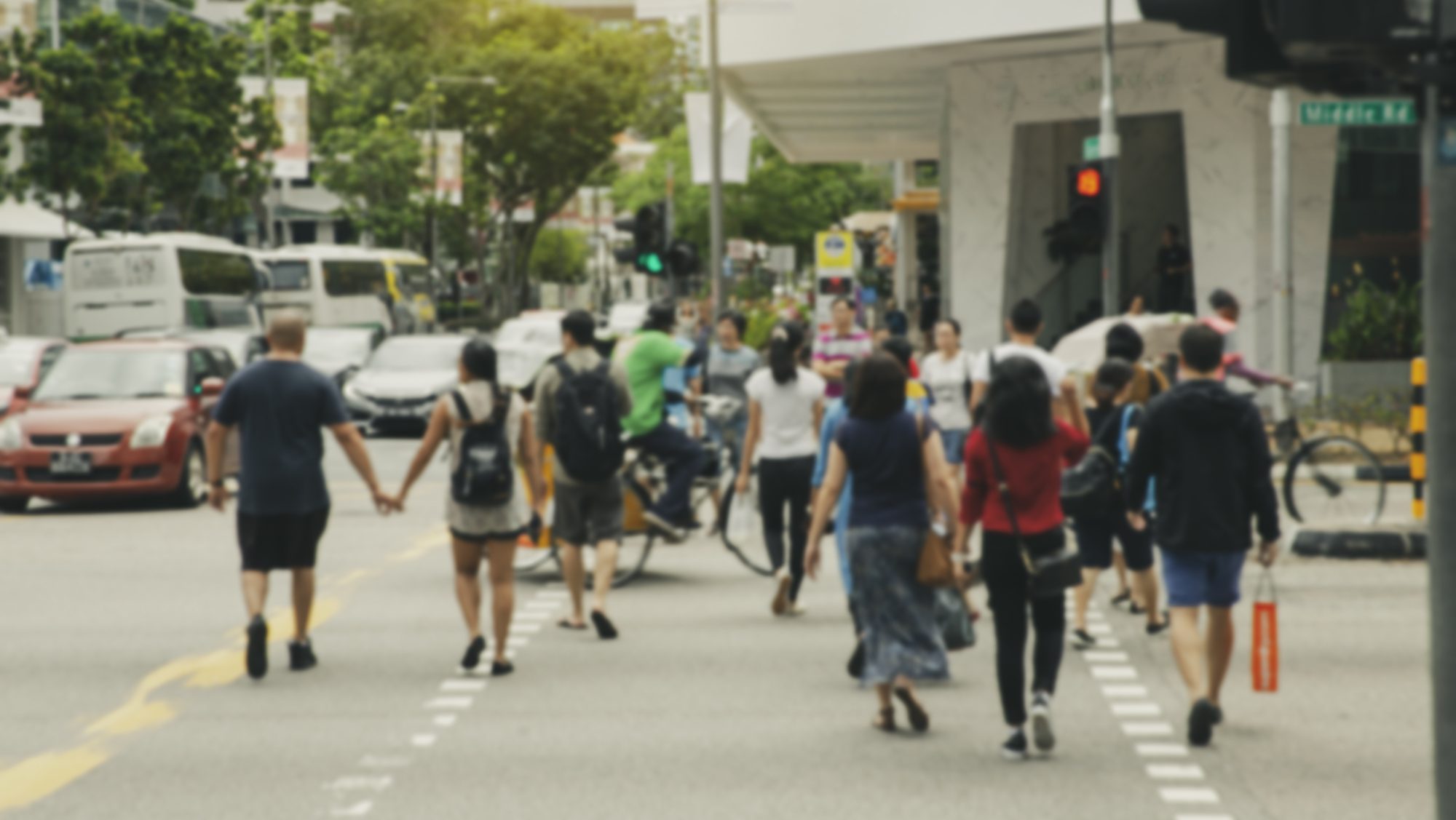 People crossing street in Orchard Rd, Singapore