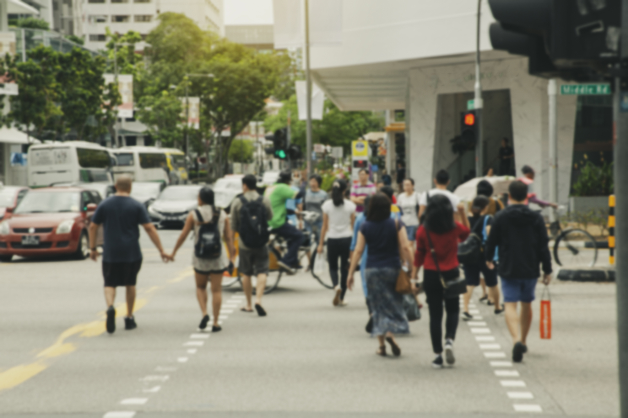 People crossing street in Orchard Rd, Singapore