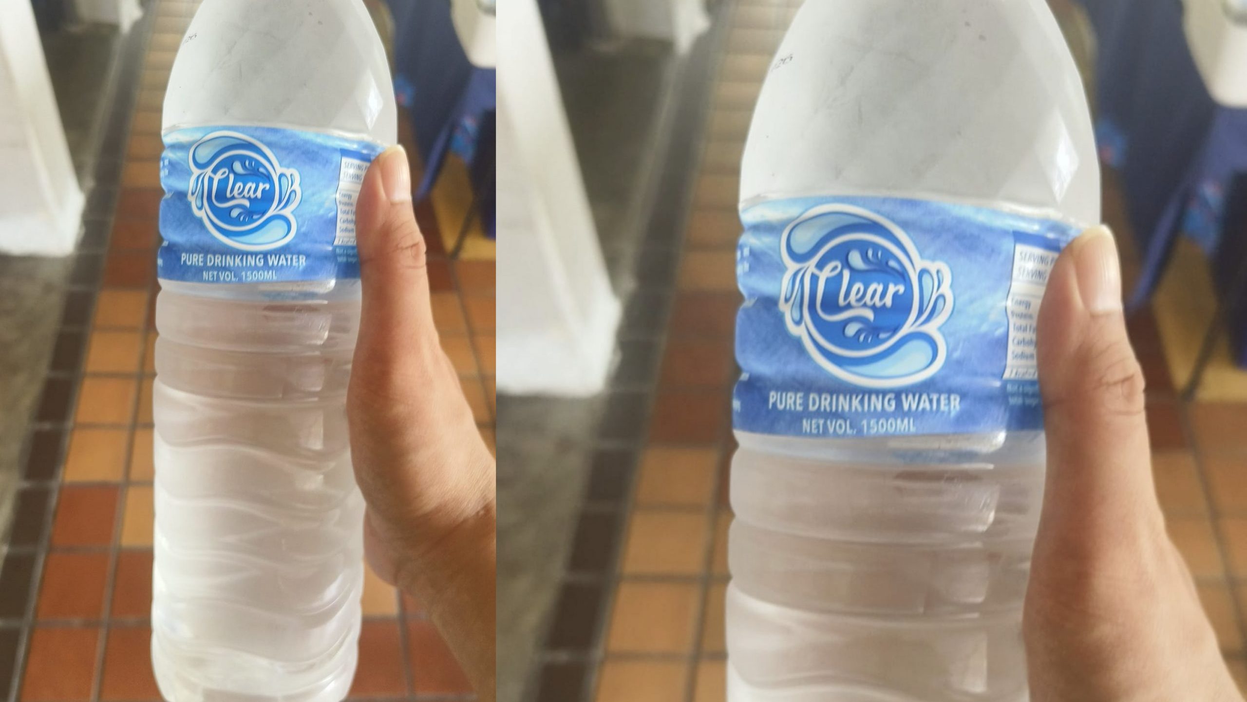 Hand holding chilled bottled water.