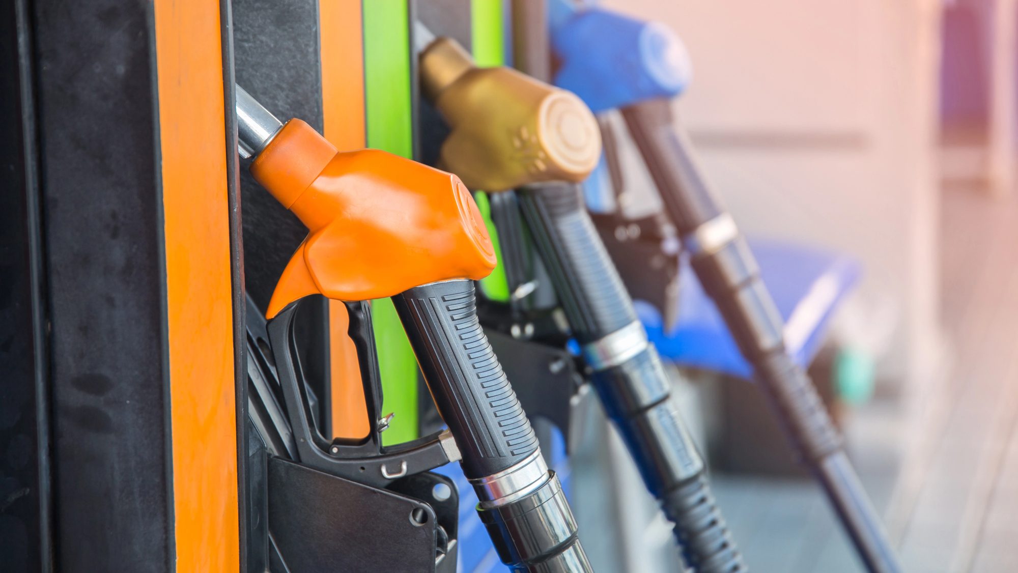 Gas pump nozzles in a service station.