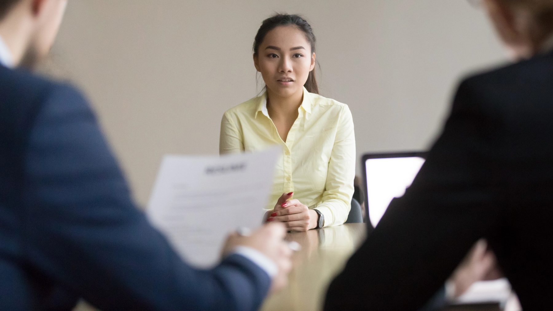 Asian applicant talk during interview with recruiters