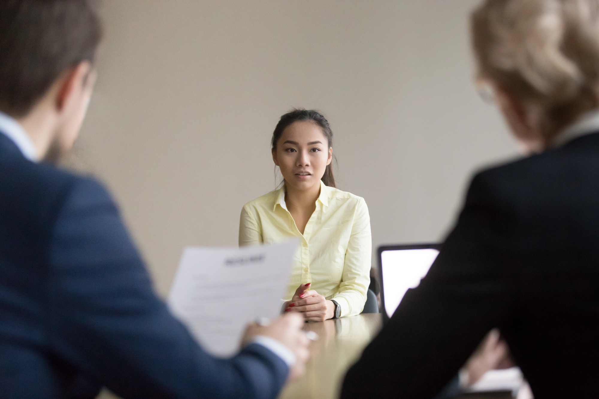 Asian applicant talk during interview with recruiters