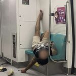 Netizens call out MRT passenger for posting “discriminatory” photo of another passenger sleeping on train