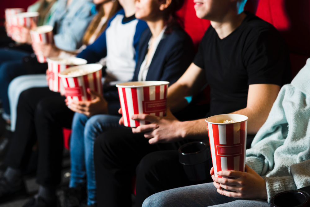 People with popcorn in the cinema