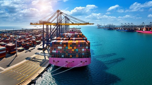 Cargo ship and cargo container in harbour