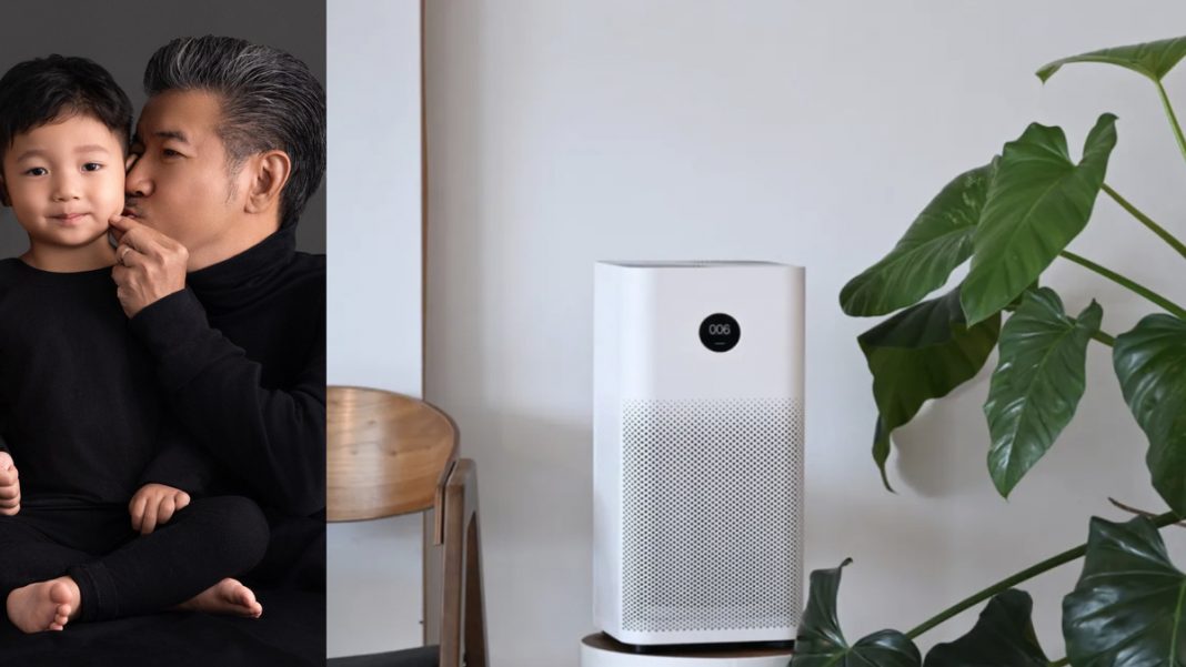 FJ SafeSpace founder Jay Choy and his son, an air purifier and a plant.