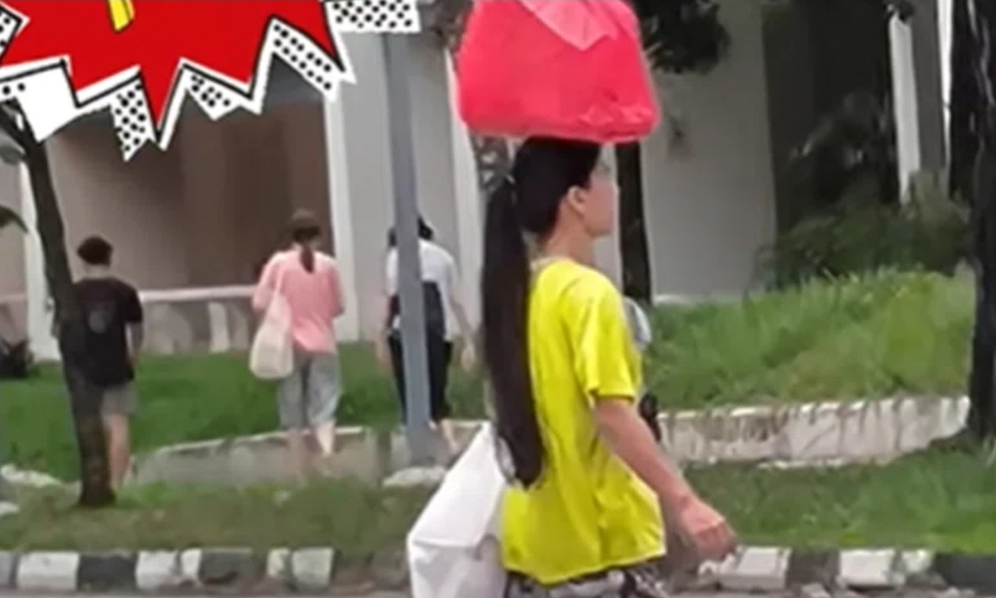 Woman balancing groceries on her head along Bukit Batok junction goes viral, sparks debate on nationality