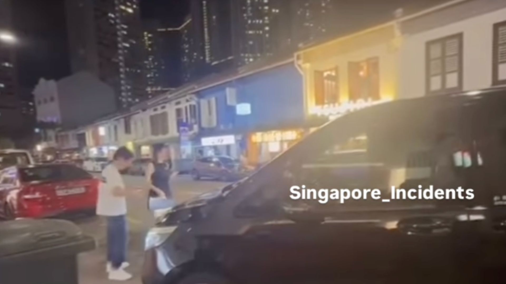 'There is no more graciousness in Singapore'— Man and woman seen blocking parking space and ignoring a car wanting to park