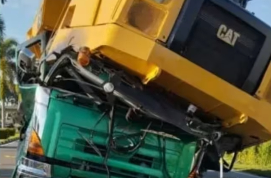 Detached trailer load crushes lorry cab and kills driver and passenger instantly