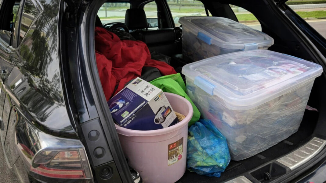 Personal belongings packed into a car boot after a Bukit Panjang family was forced to sleep in their vehicle for more than two weeks due to renovation delays at their new home.
