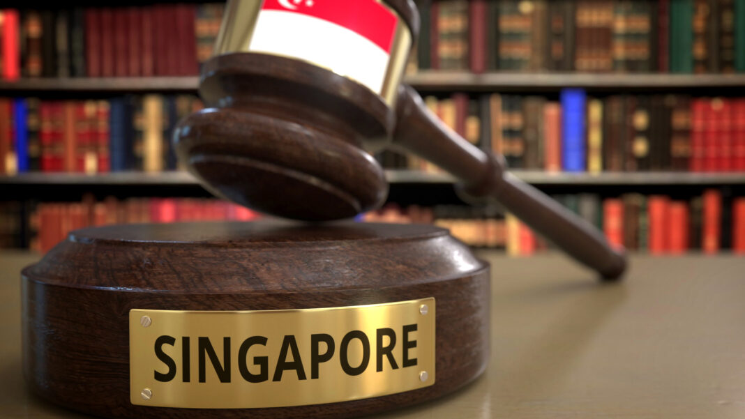 A wooden gavel and base labelled 